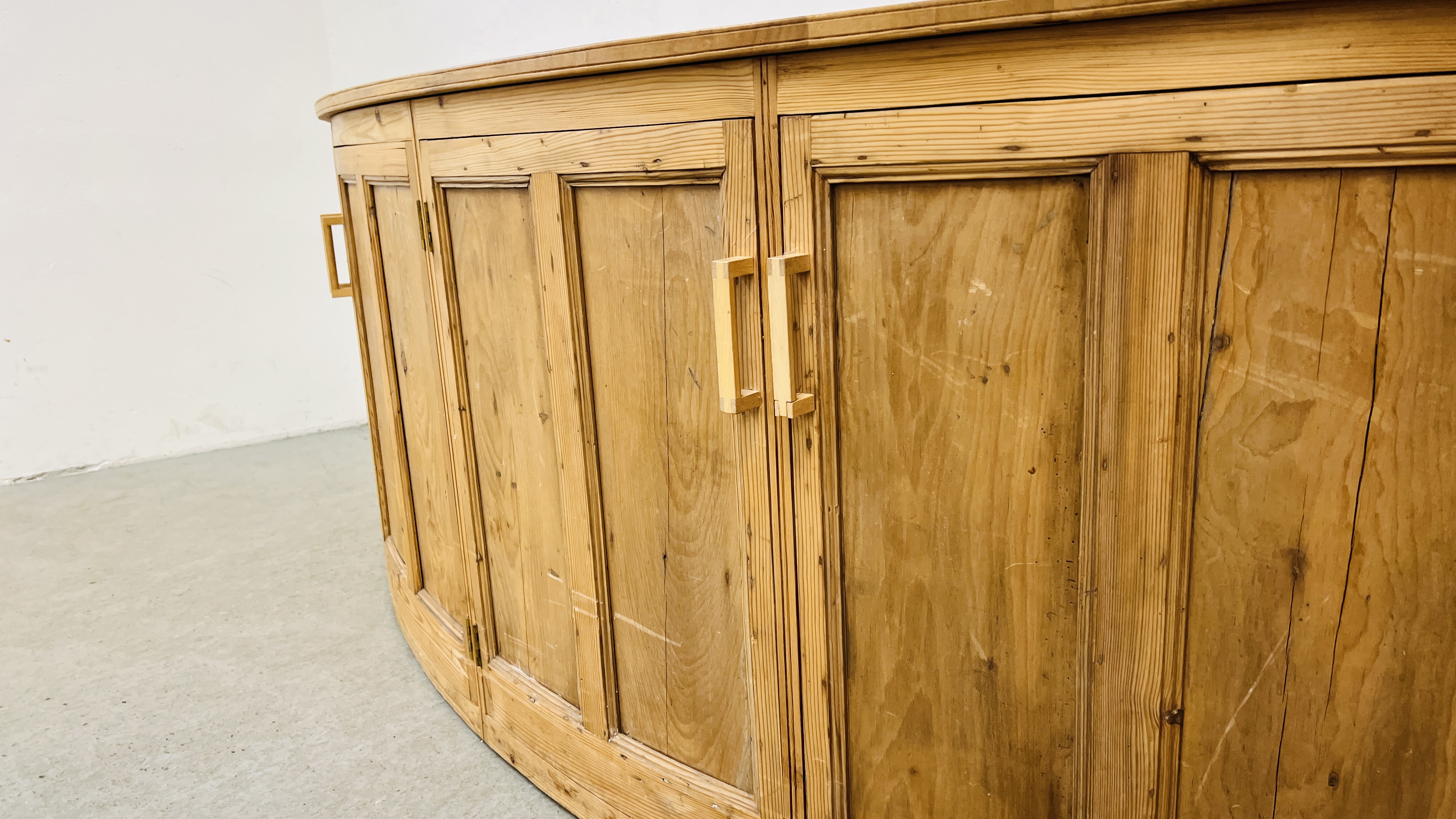 A LARGE SOLID PINE BOW FRONTED 4 DOOR SIDE CABINET W 246CM. X D 61CM. X H 96CM. - Image 6 of 11