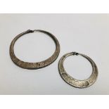 TWO EASTERN TRIBAL STYLE WHITE METAL JEWELLERY ACCESSORIES WITH IMPRESSED DESIGN.