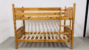 A PINE FRAME BUNK BED