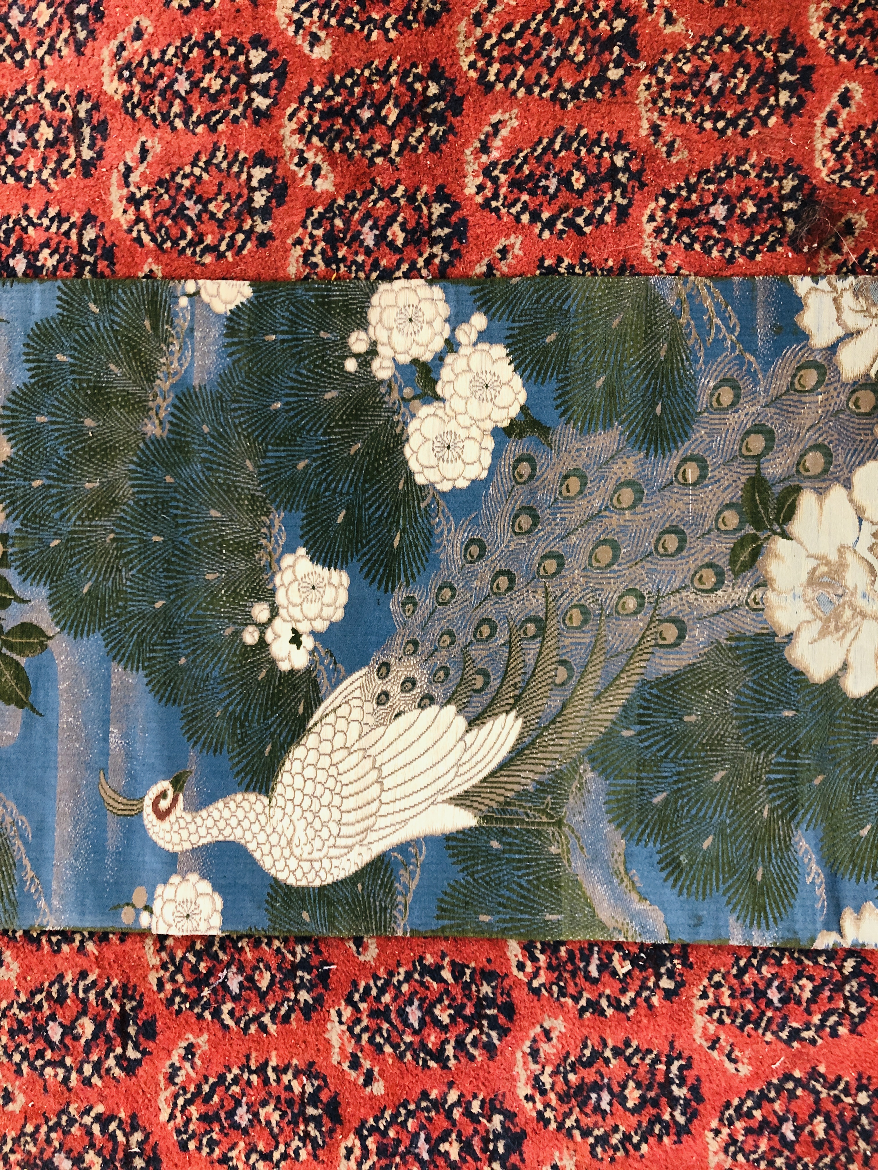 A CHINESE SILK "OBI" ON A DARK BLUE FIELD DECORATED WITH PEACOCKS AND FLOWERS. - Image 4 of 4