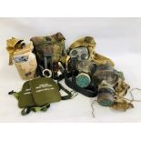 A GROUP OF MILITARY COLLECTIBLES TO INCLUDE 4 GAS MASKS (COLLECTORS ITEM ONLY) ALONG WITH TWO