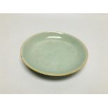 A CHINESE CELADON DISH, PROBABLY C18TH (RIM CHIP) DIA. 18CM.