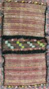 A DOUBLE SADDLE BAG WOVEN WITH COLUMNS INCLUDING STYLIZED "S" DESIGNS, PROBABLY BELOUCH WIDTH 111CM.