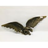 A LARGE IMPRESSIVE CAST METAL EAGLE, WING SPAN OF 75CM IN BRASS FINISH.