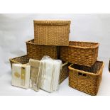 A GROUP OF 5 WICKER BASKETS AND ONE OTHER ALONG WITH VARIOUS FOLDING STORAGE BAGS.