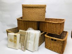 A GROUP OF 5 WICKER BASKETS AND ONE OTHER ALONG WITH VARIOUS FOLDING STORAGE BAGS.