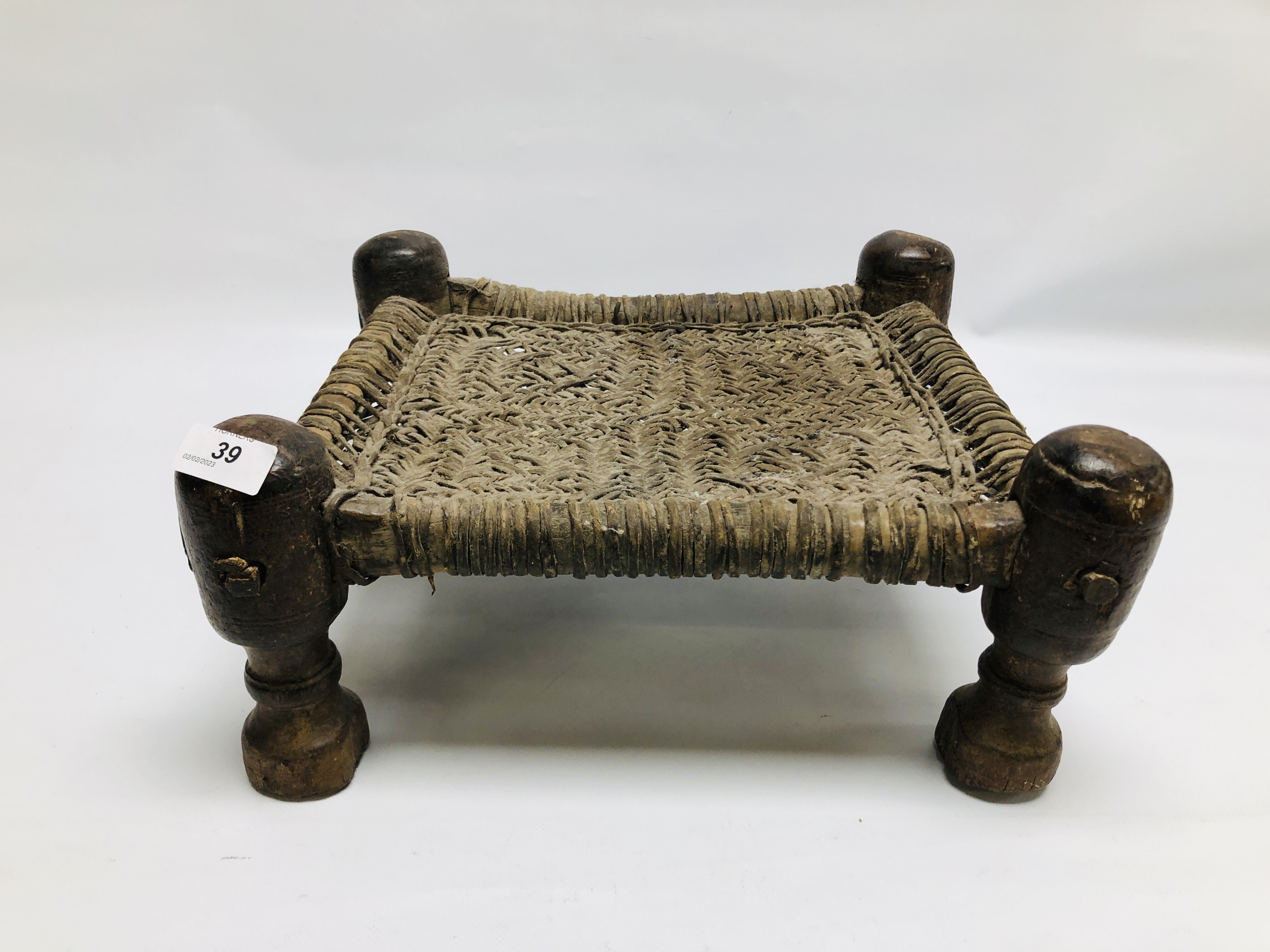 A MIDDLE EASTERN SWAT STYLE LOW STOOL.