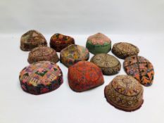 A GROUP OF ELEVEN EASTERN AND ASIAN WOVEN AND EMBROIDERED HATS TO INCLUDE AFGHAN EXAMPLES