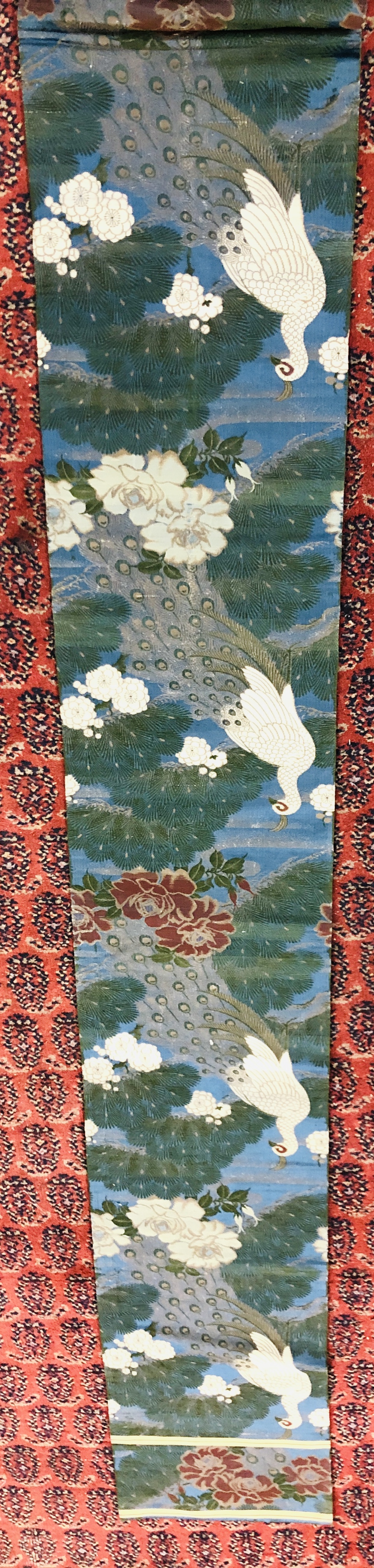 A CHINESE SILK "OBI" ON A DARK BLUE FIELD DECORATED WITH PEACOCKS AND FLOWERS. - Image 3 of 4