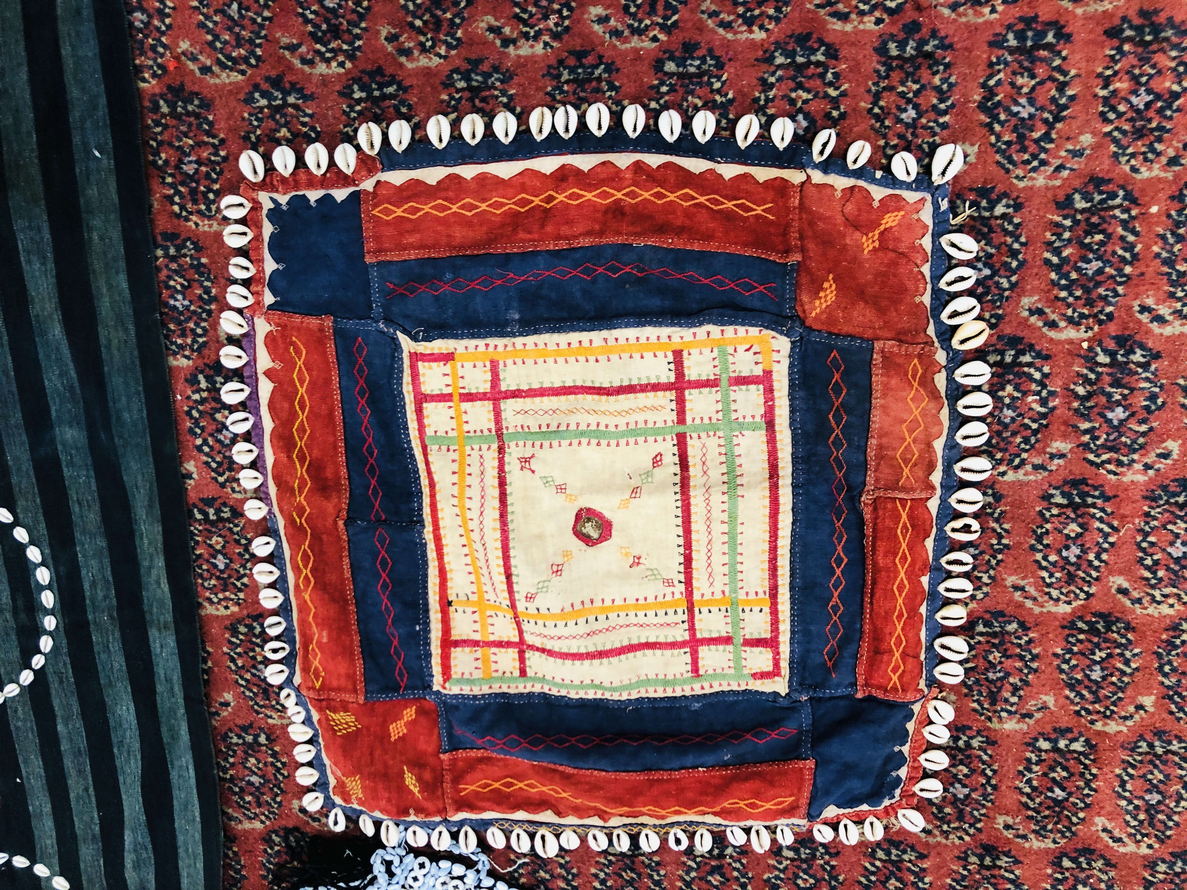 A GROUP OF ETHNIC TRIBAL TEXTILES TO INCLUDE A CLOTH / COVER DECORATED WITH "COWRIE" SHELL APPLIED - Image 10 of 15
