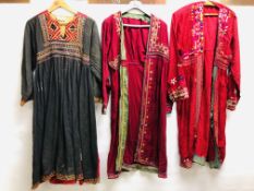 AN AFGHAN EMBROIDERED DRESS ALONG WITH TWO AFGHAN STYLE EMBROIDERED ROBES TO INCLUDE A SILK EXAMPLE