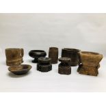 A GROUP OF MAINLY ETHNIC HARDWOOD CARVED ARTIFACTS COMPRISING OF VARIOUS VESSELS AND CANDLE HOLDERS