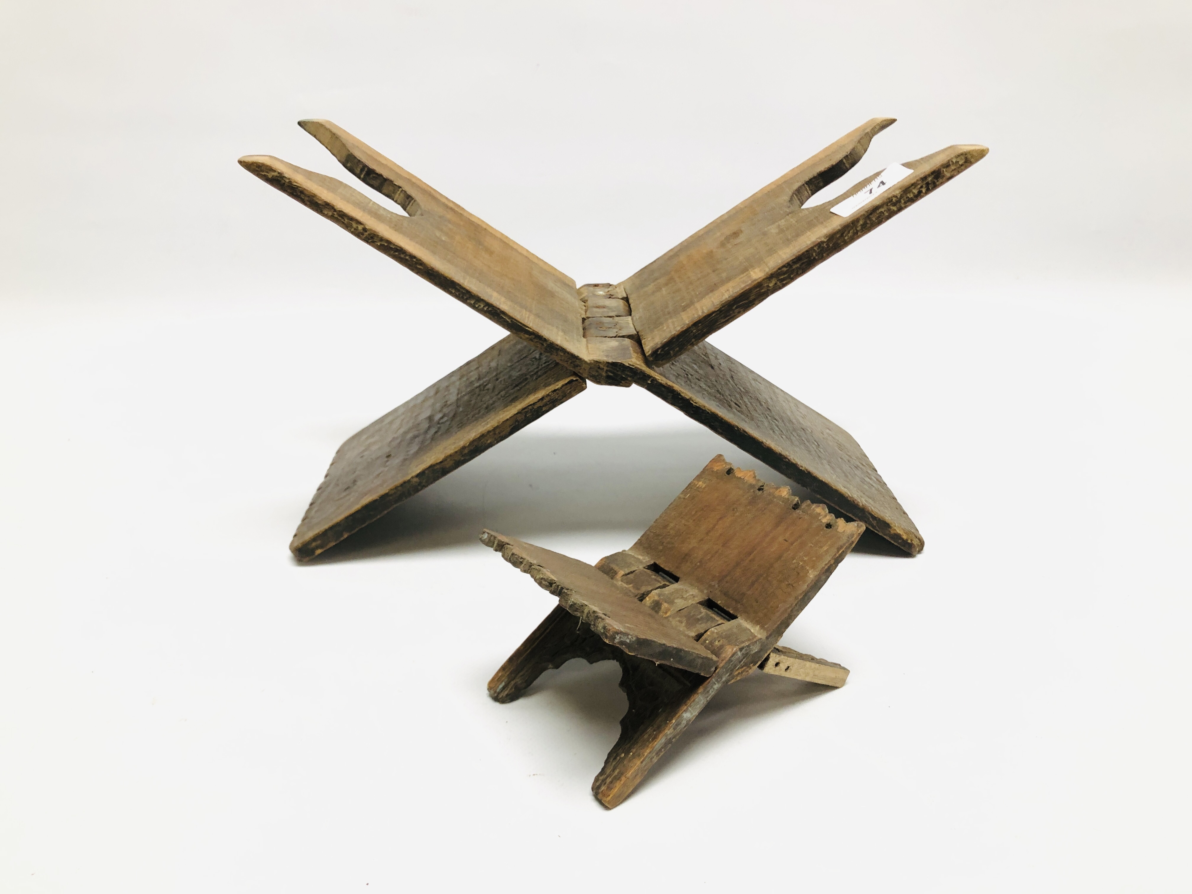 TWO CARVED HARDWOOD FOLDING RESTS LENGTH 34CM. AND LENGTH 13CM.