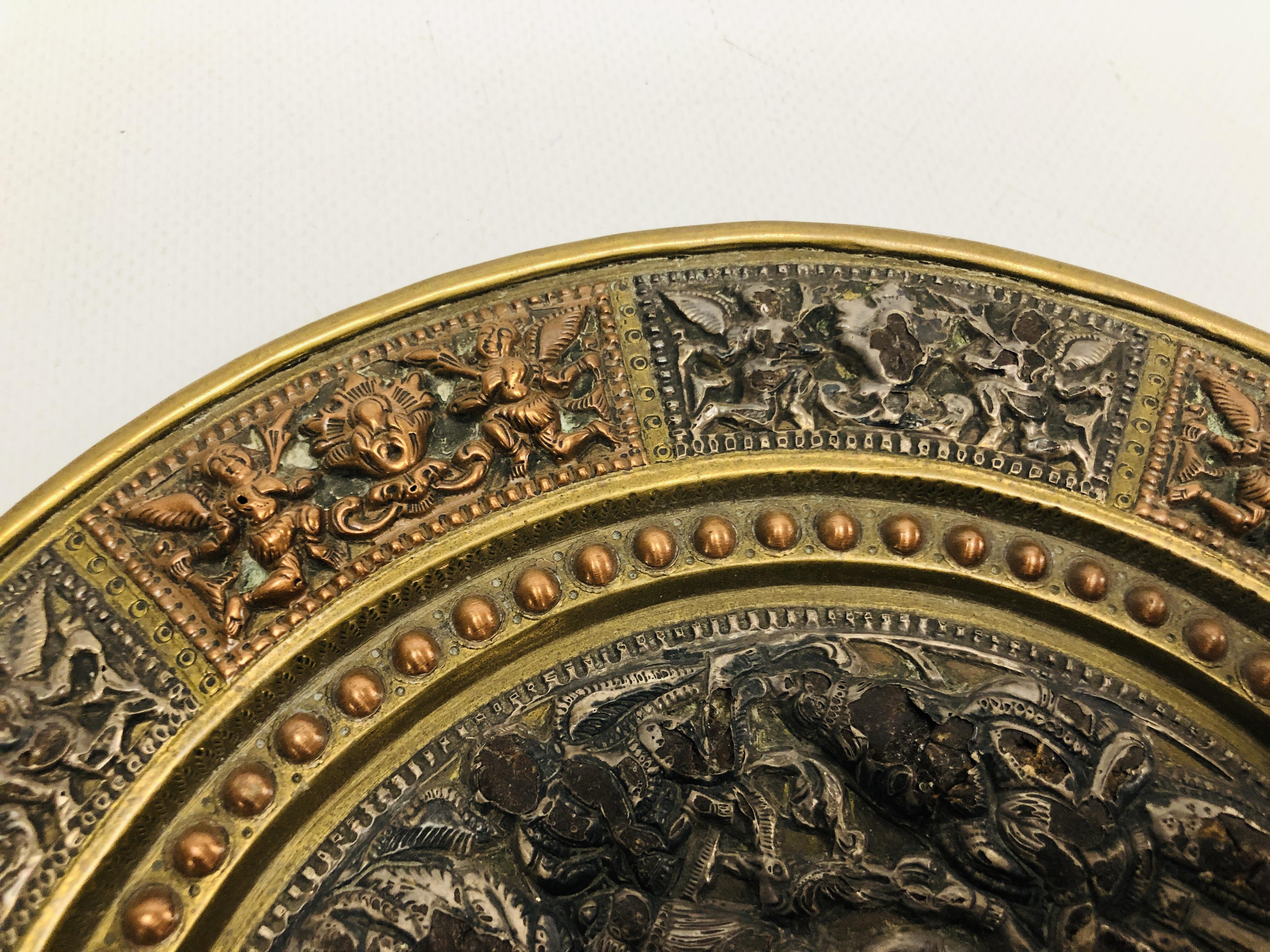 AN INDIAN BRASS AND COPPER MARRIAGE PLATE THE CENTRE WITH SILVERED FIGURES, - Image 7 of 11