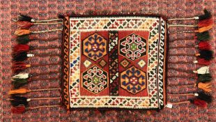 AFGHAN KELIM FOUR HEXAGONAL MOTIF ON A RED FIELD,