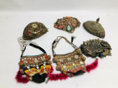 A GROUP OF SIX EASTERN AND ASIAN WOVEN AND EMBROIDERED HATS WITH EMBELLISHED DETAIL