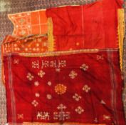 A GROUP OF FOUR EASTERN AND ASIAN STYLE HAND CRAFTED NEEDLEWORK CLOTH PANEL EXAMPLES.