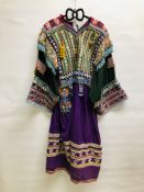 AN AFGHAN KUCHI STYLE TRIBAL DRESS DECORATED WITH ELABORATE EMBROIDERY,