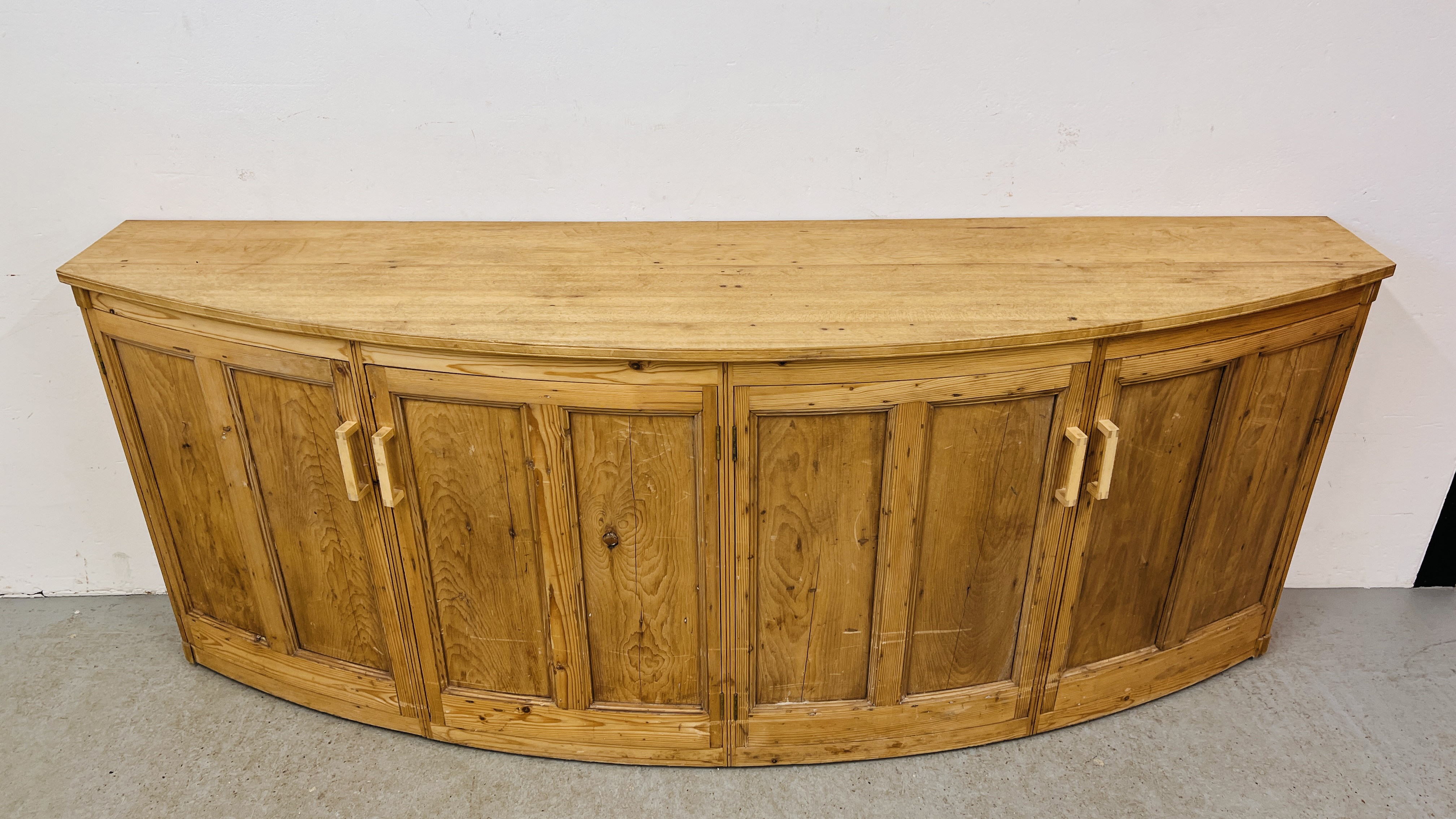 A LARGE SOLID PINE BOW FRONTED 4 DOOR SIDE CABINET W 246CM. X D 61CM. X H 96CM. - Image 2 of 11