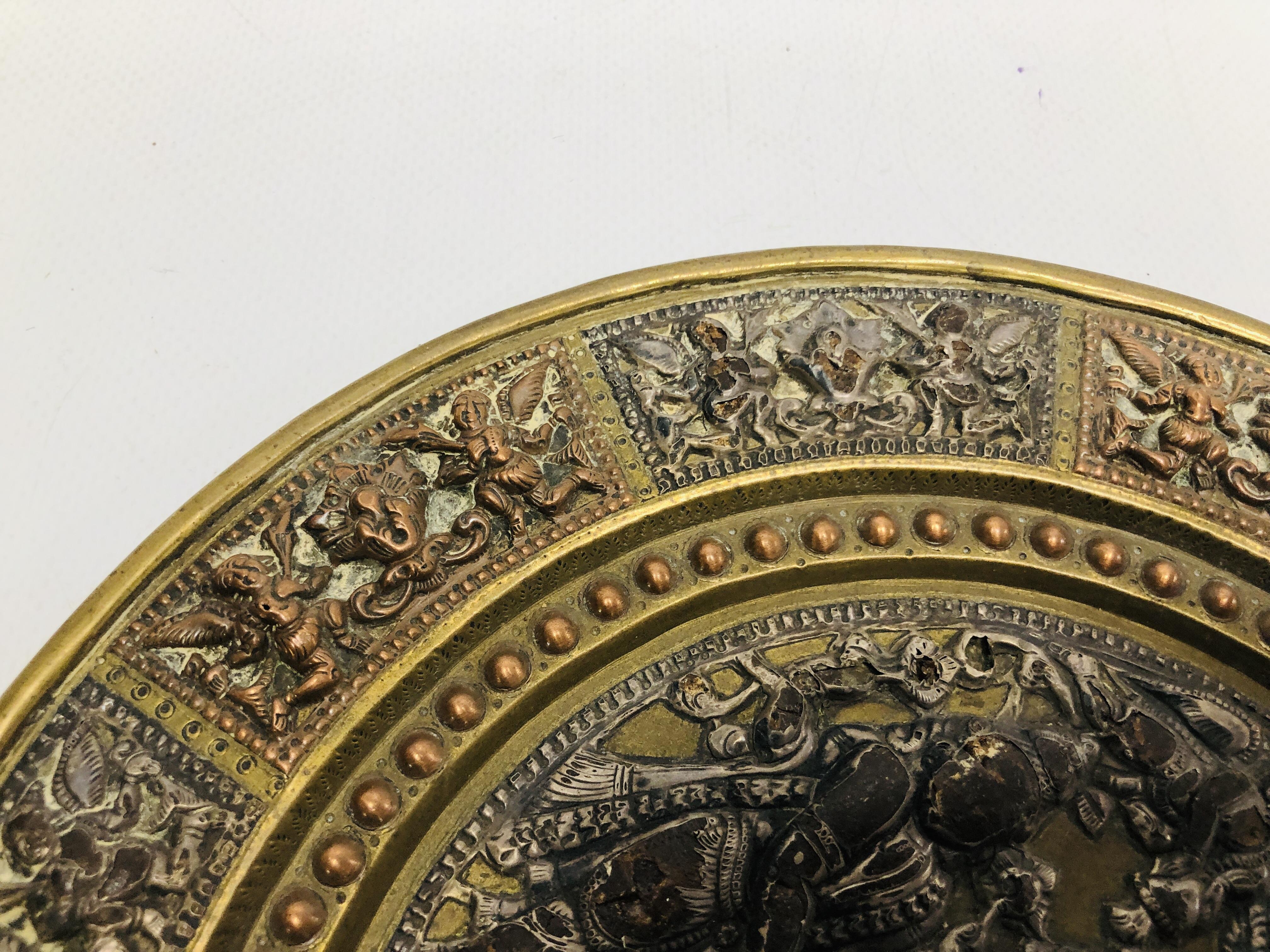 AN INDIAN BRASS AND COPPER MARRIAGE PLATE THE CENTRE WITH SILVERED FIGURES, - Image 10 of 11