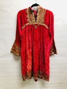AN AFGHAN PINK VELVET DRESS EMBROIDERED WITH A FINE GILT THREAD