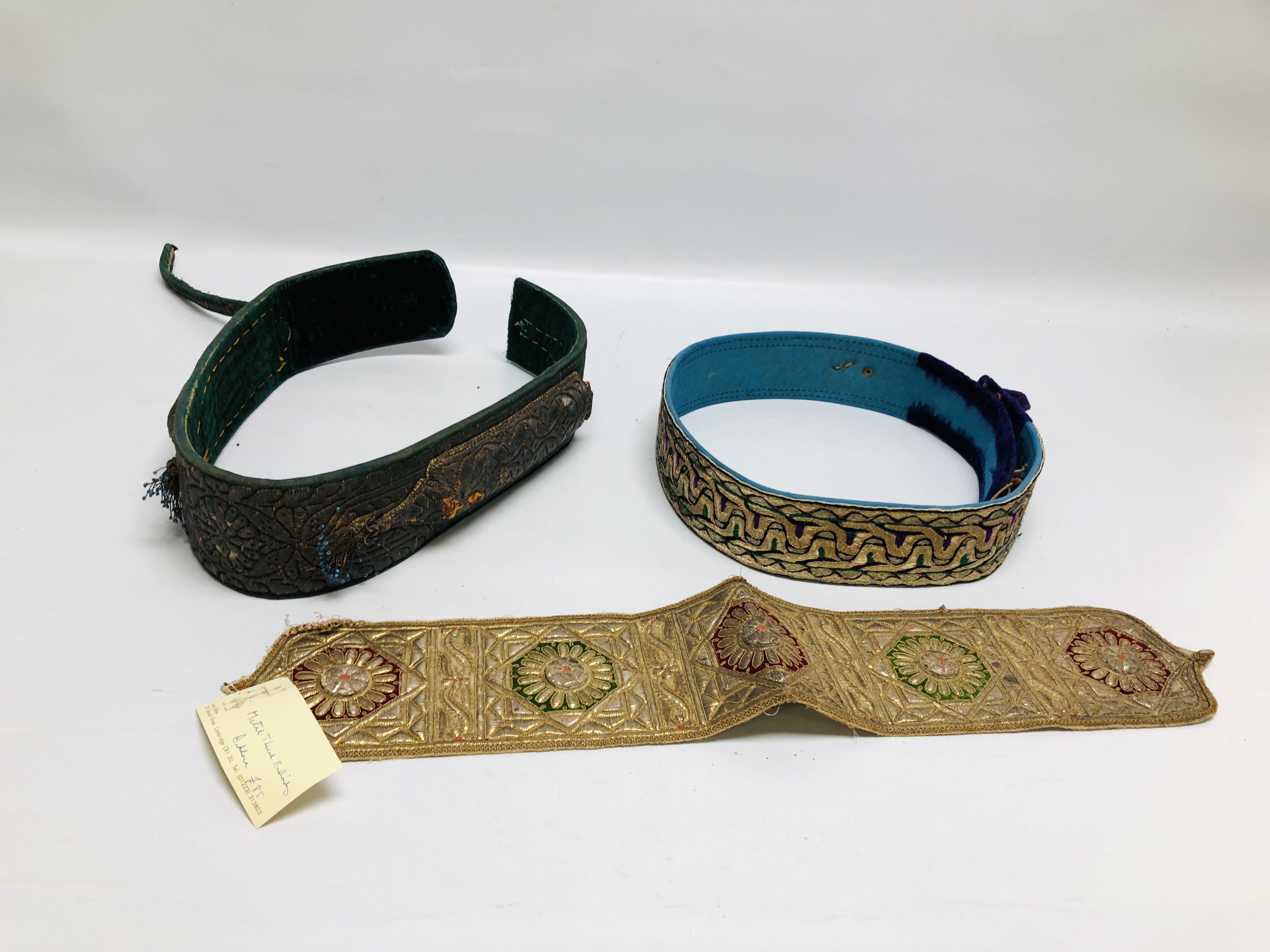 TWO MIDDLE EASTERN WOVEN BELTS ALONG WITH A VINTAGE METAL WORK THREADED PANEL