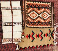 TWO MODERN WOOL RUGS ALONG WITH A FOLK ART EMBROIDERED RUNNER.