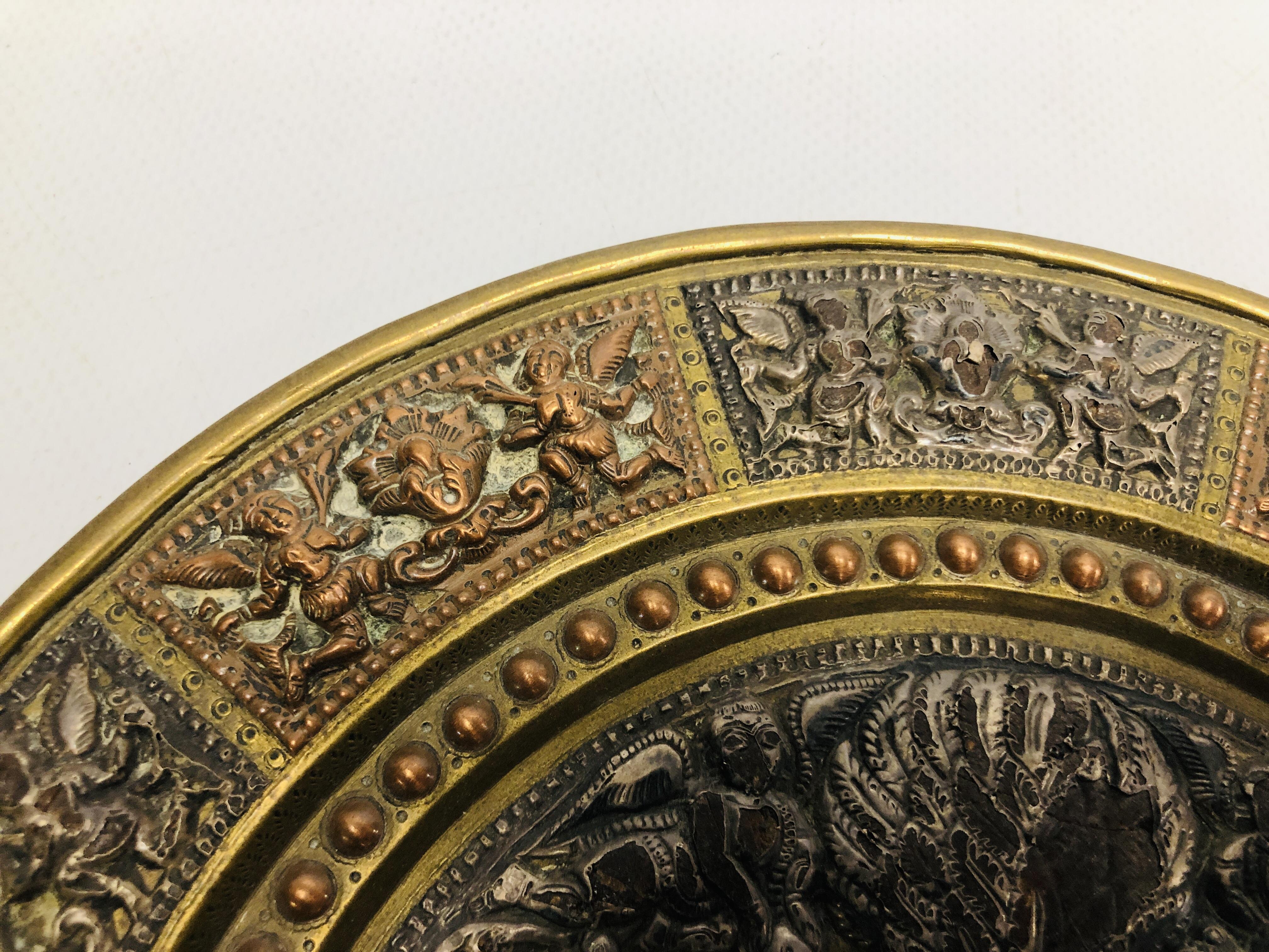 AN INDIAN BRASS AND COPPER MARRIAGE PLATE THE CENTRE WITH SILVERED FIGURES, - Image 6 of 11