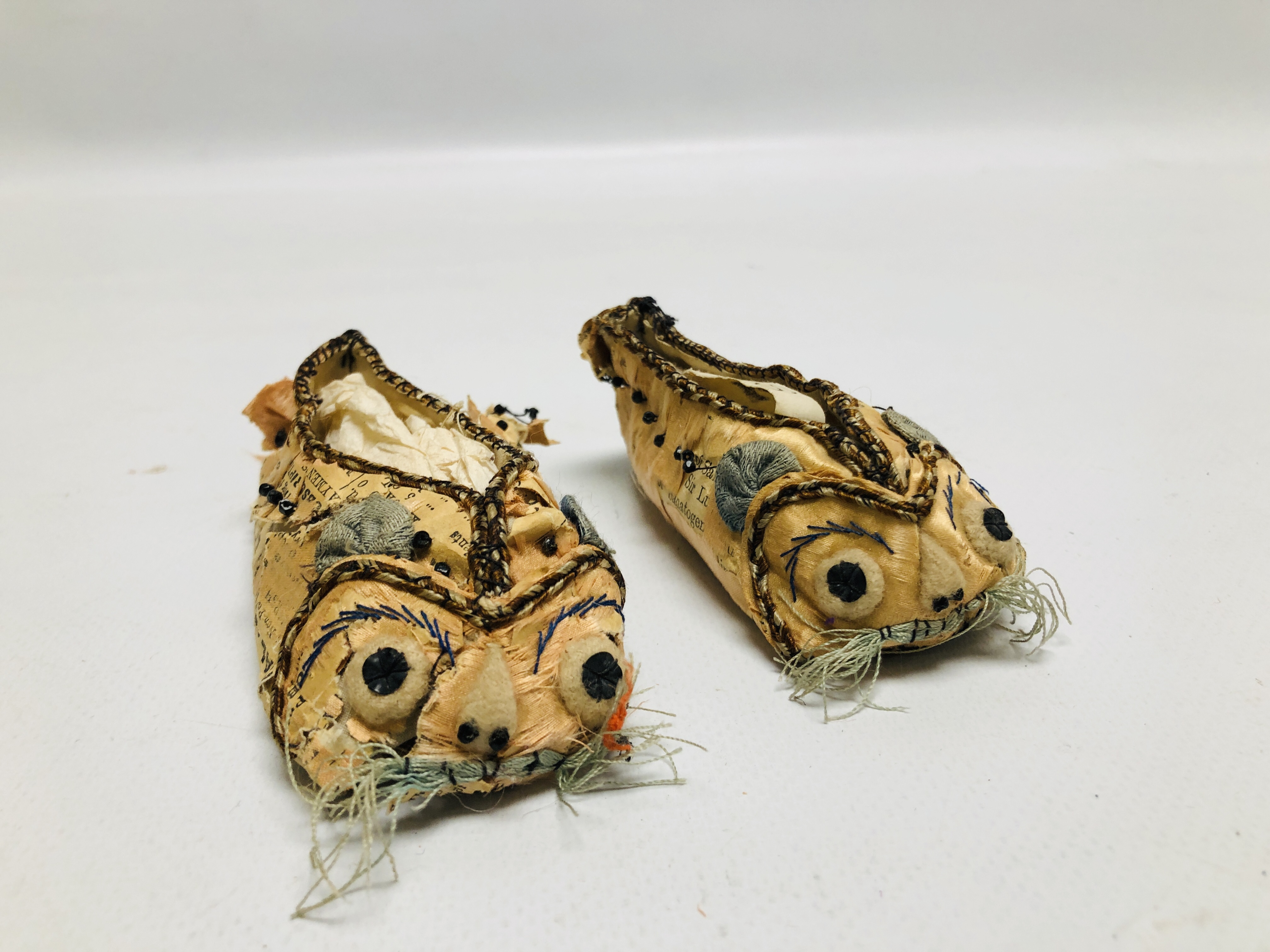 A PAIR OF HANDMADE SILK AND PAPER EMBROIDERED BABY SHOES, C19TH, L 10CM.