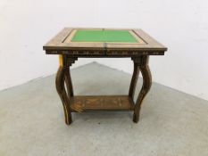 A REPRODUCTION HIGHLY DECORATIVE INLAID AND MOTHER OF PEARL GAMES TABLE A/F.