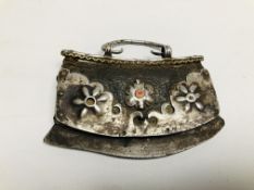 AN ELABORATE EASTERN TRIBAL STYLE PURSE, THE MAIN BODY LEATHER WITH APPLIED METAL WORK.