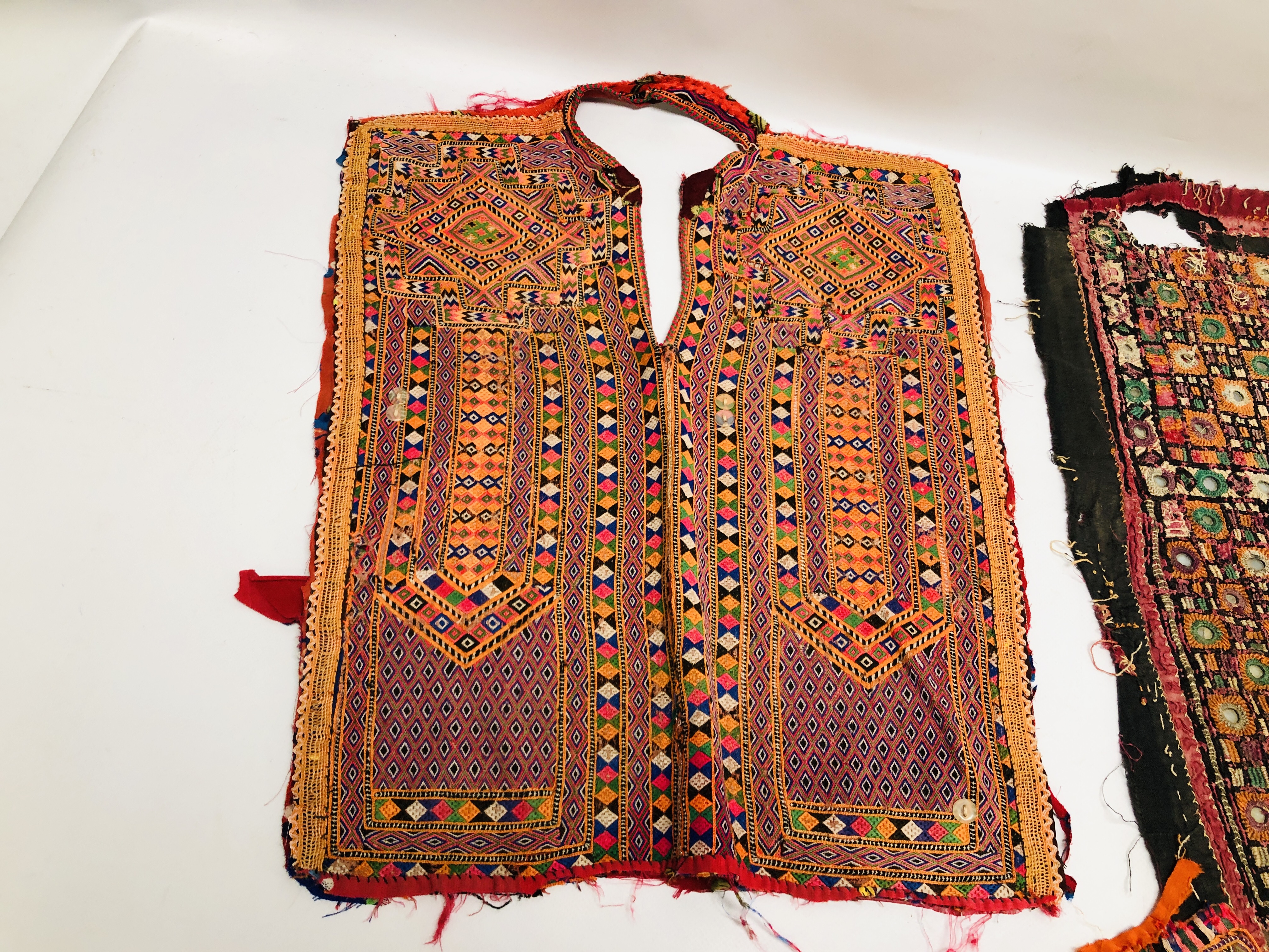 A GROUP OF ETHNIC AND TRIBAL GARMENTS TO INCLUDE DRESS YOLKS TO INCLUDE ELABORATELY HAND MADE - Image 2 of 10