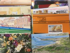 A COLLECTION OF GUERNSEY AND ALDERNEY PRESENTATION PACKS,