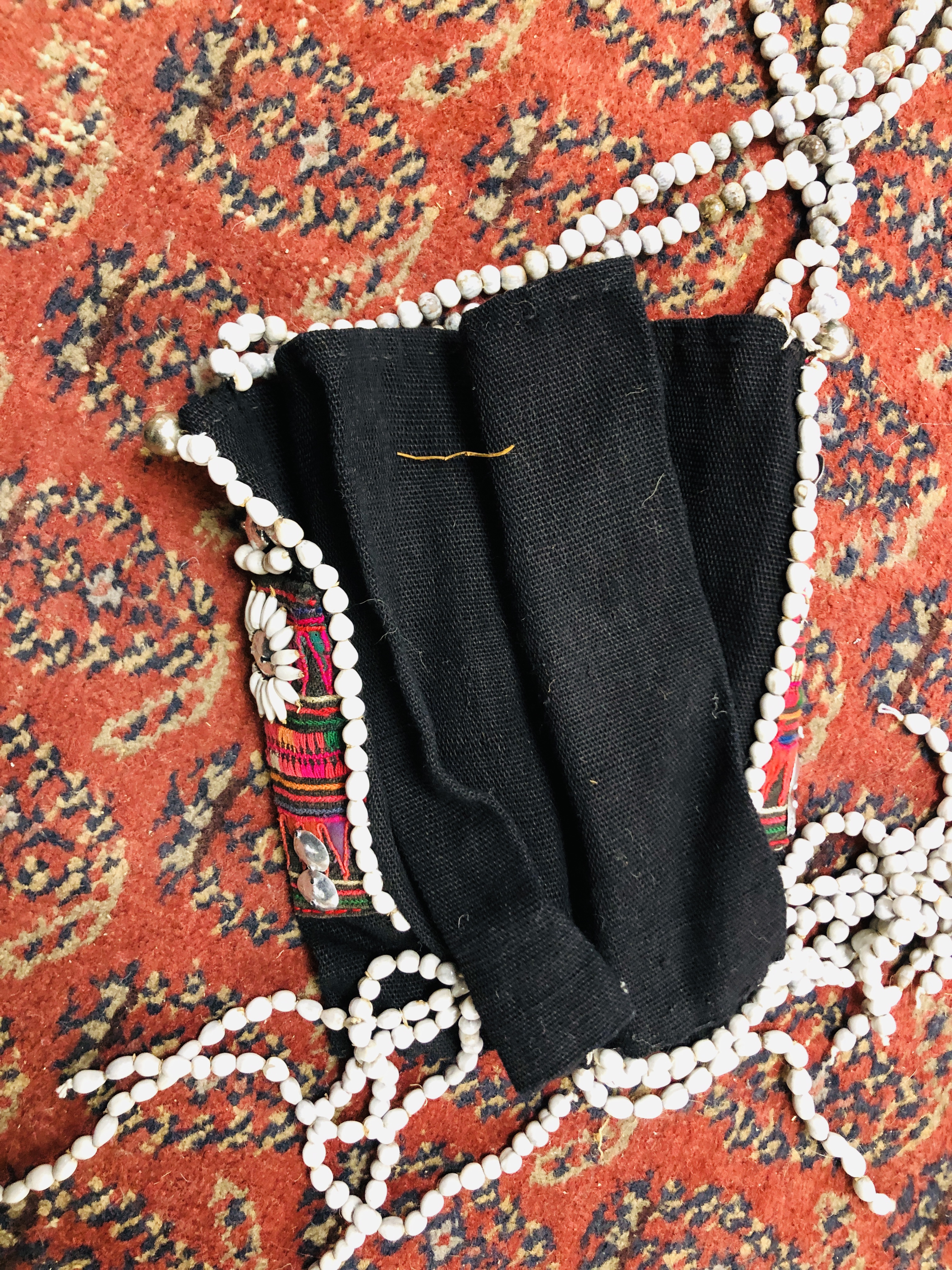 A GROUP OF ETHNIC TRIBAL TEXTILES TO INCLUDE A CLOTH / COVER DECORATED WITH "COWRIE" SHELL APPLIED - Image 8 of 15