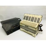 A VINTAGE HOHNER VERDI I ACCORDION IN FITTED BLACK LEATHER TRAVEL CASE