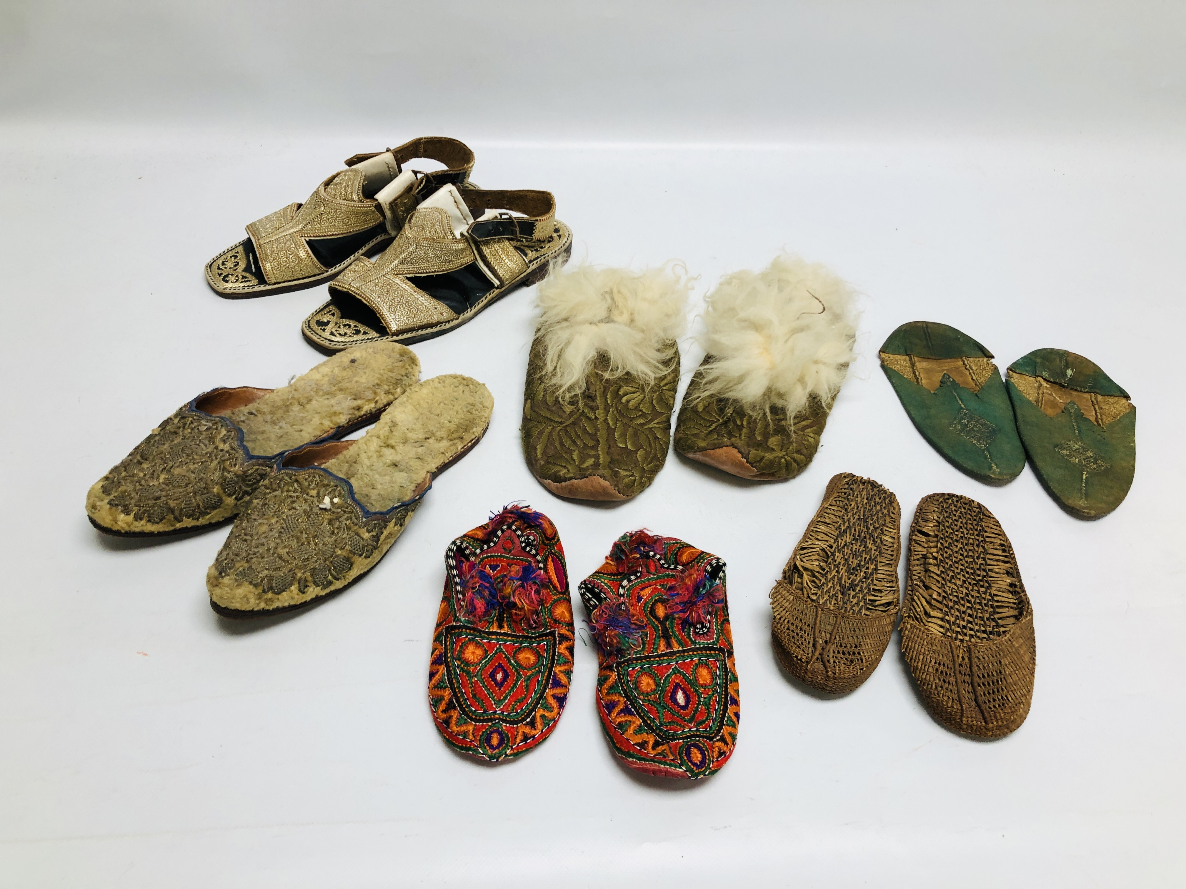 THREE PAIRS OF AFGHAN SHOES INCLUDING SANDALS ALONG WITH A FURTHER THREE PAIRS OF SMALL SHOES,