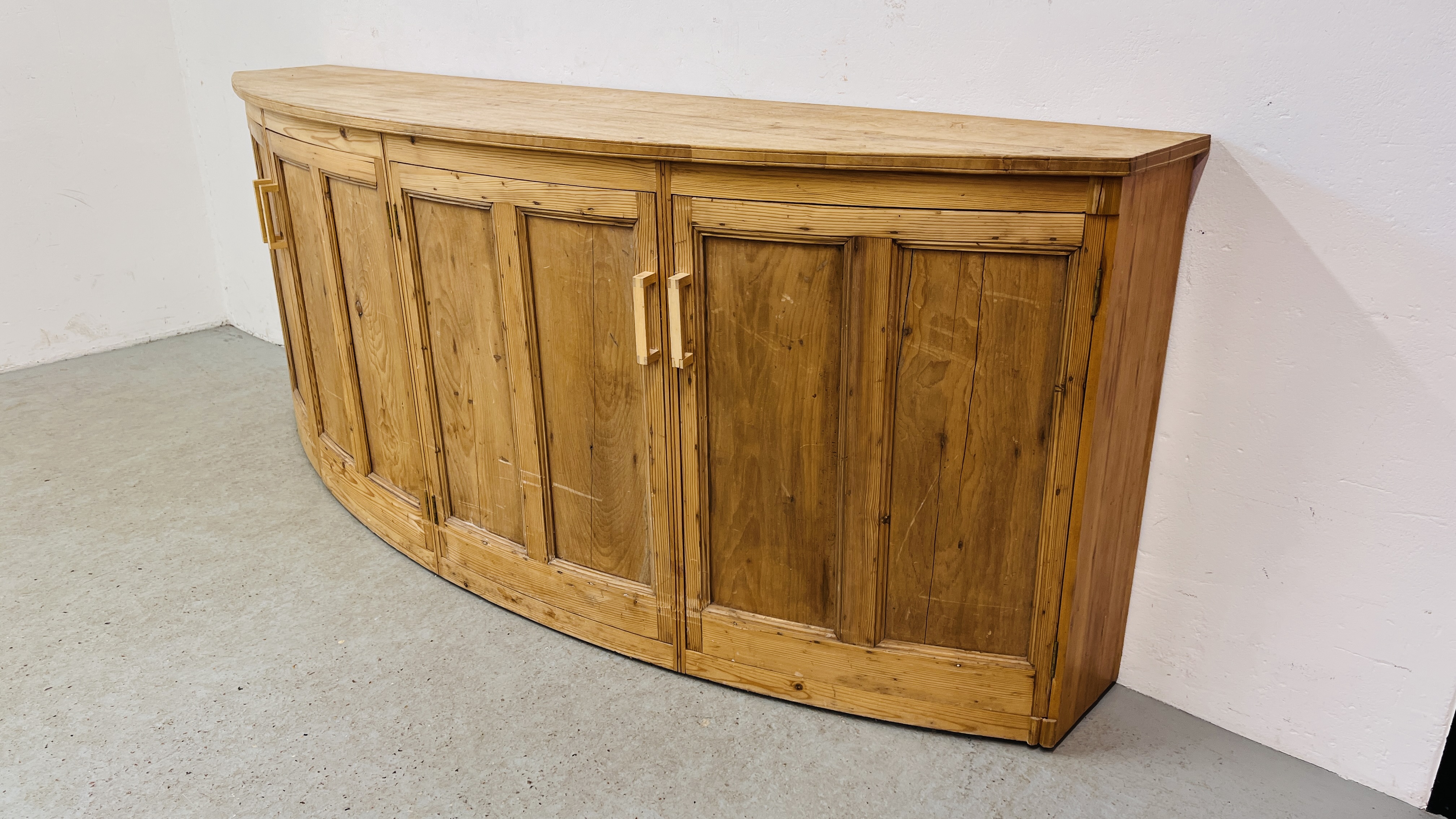 A LARGE SOLID PINE BOW FRONTED 4 DOOR SIDE CABINET W 246CM. X D 61CM. X H 96CM. - Image 3 of 11