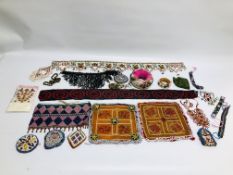 A GROUP OF INDIAN INSPIRED BEADED ARTICLES TO INCLUDE PURSES, HEAD DRESSES, BELTS AND PANELS.