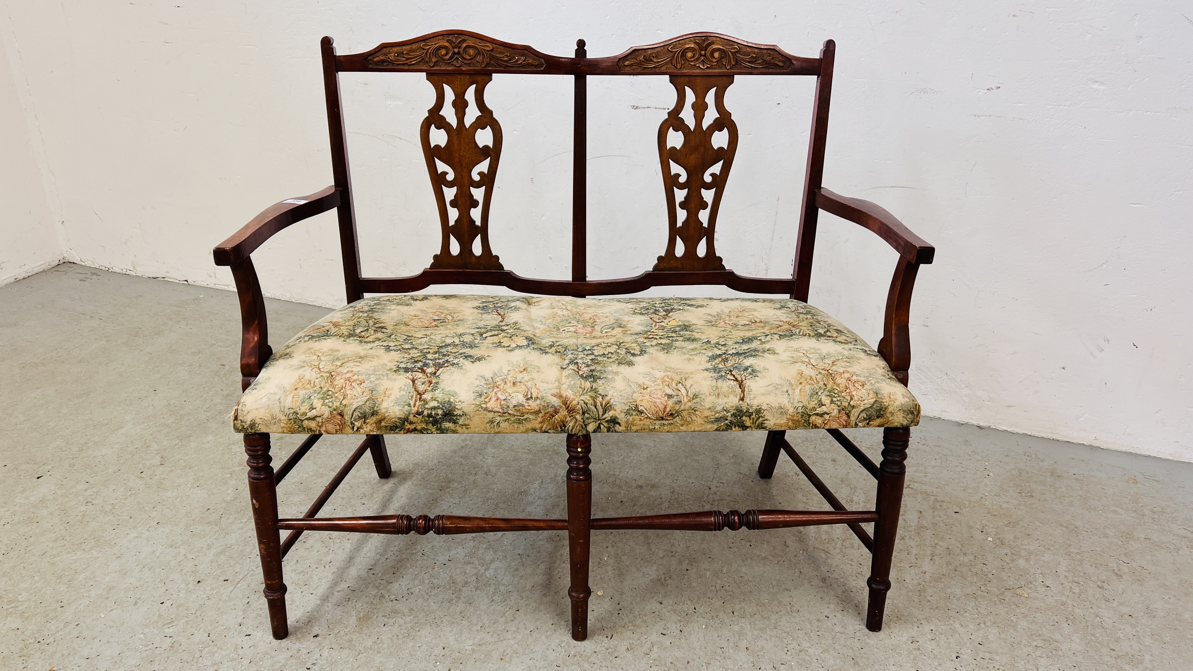 ANTIQUE MAHOGANY LOVERS SEAT WITH FRET BACK AND CARVED DETAILING