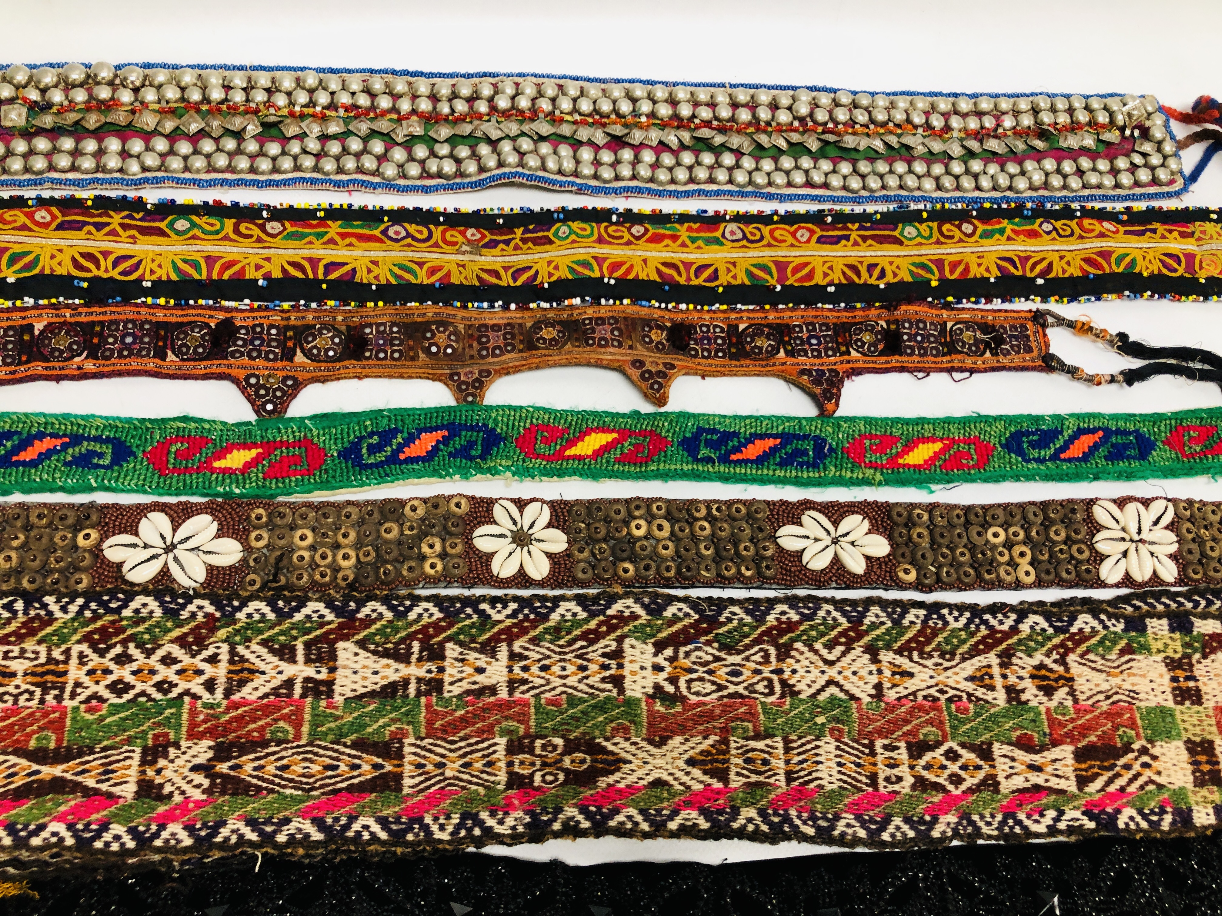 BOX OF EASTERN AND ASIAN TRIBAL ART BELTS AND PANELS TO INCLUDE EMBROIDERED, - Image 5 of 6