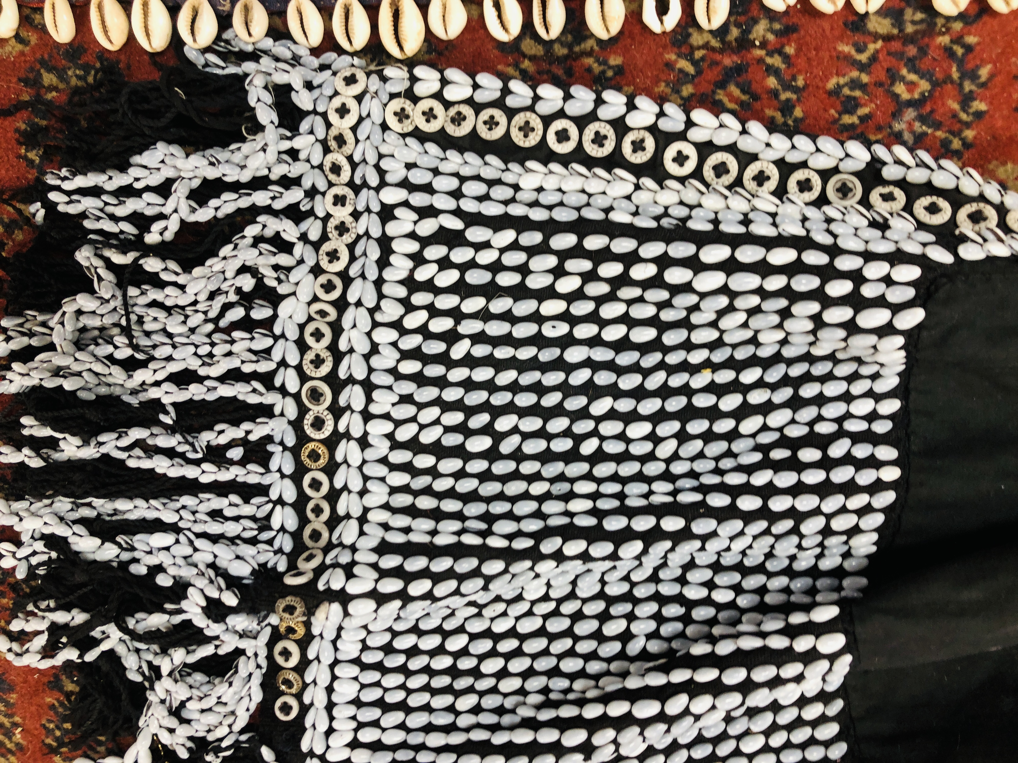 A GROUP OF ETHNIC TRIBAL TEXTILES TO INCLUDE A CLOTH / COVER DECORATED WITH "COWRIE" SHELL APPLIED - Image 13 of 15