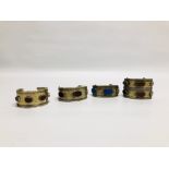 A GROUP OF 4 EASTERN STYLE WHITE METAL CUFF BRACELETS, INSET WITH OVAL STONES.