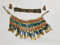 AN EGYPTIAN STYLE JEWELLERY SET COMPRISING OF A CUFF BRACELET, CLIP EARRINGS AND FACE COVERING,