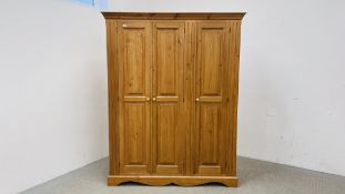 A GOOD QUALITY SOLID HONEY PINE TRIPLE WARDROBE WITH MOULDED TOP, W 152CM, D 56CM, H 192CM.