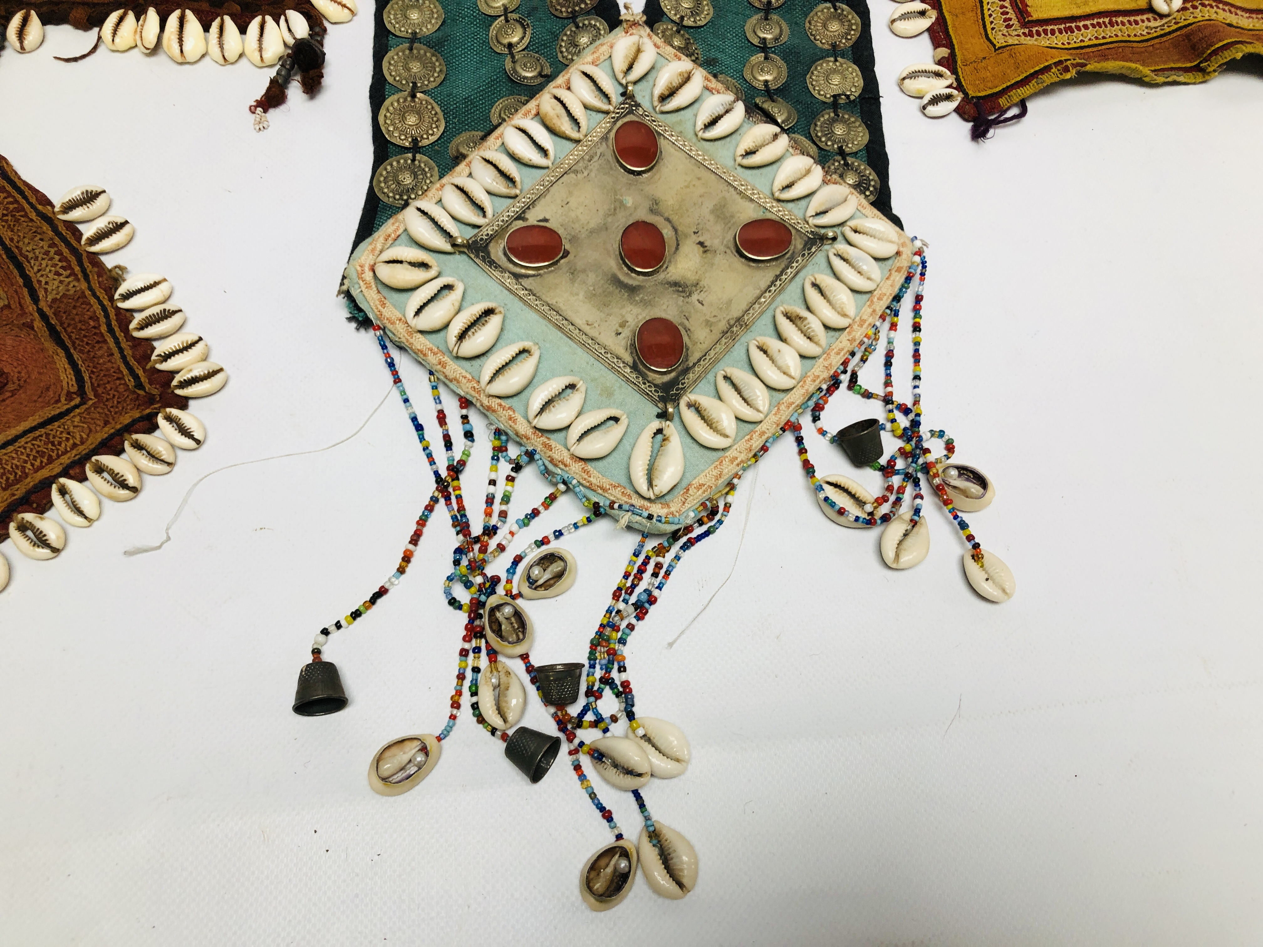 A GROUP OF FIVE VARIOUS AFGHAN TEXTILE PIECES APPLIED WITH COWRIE SHELLS AND OTHER DECORATION - Image 7 of 10