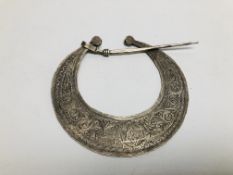 A WHITE METAL EASTERN STYLE "FIBULA" GARMENT FASTENER.