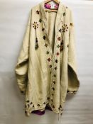 AN AFGHAN EMBROIDERED WOOL COAT (REQUIRES ATTENTION)