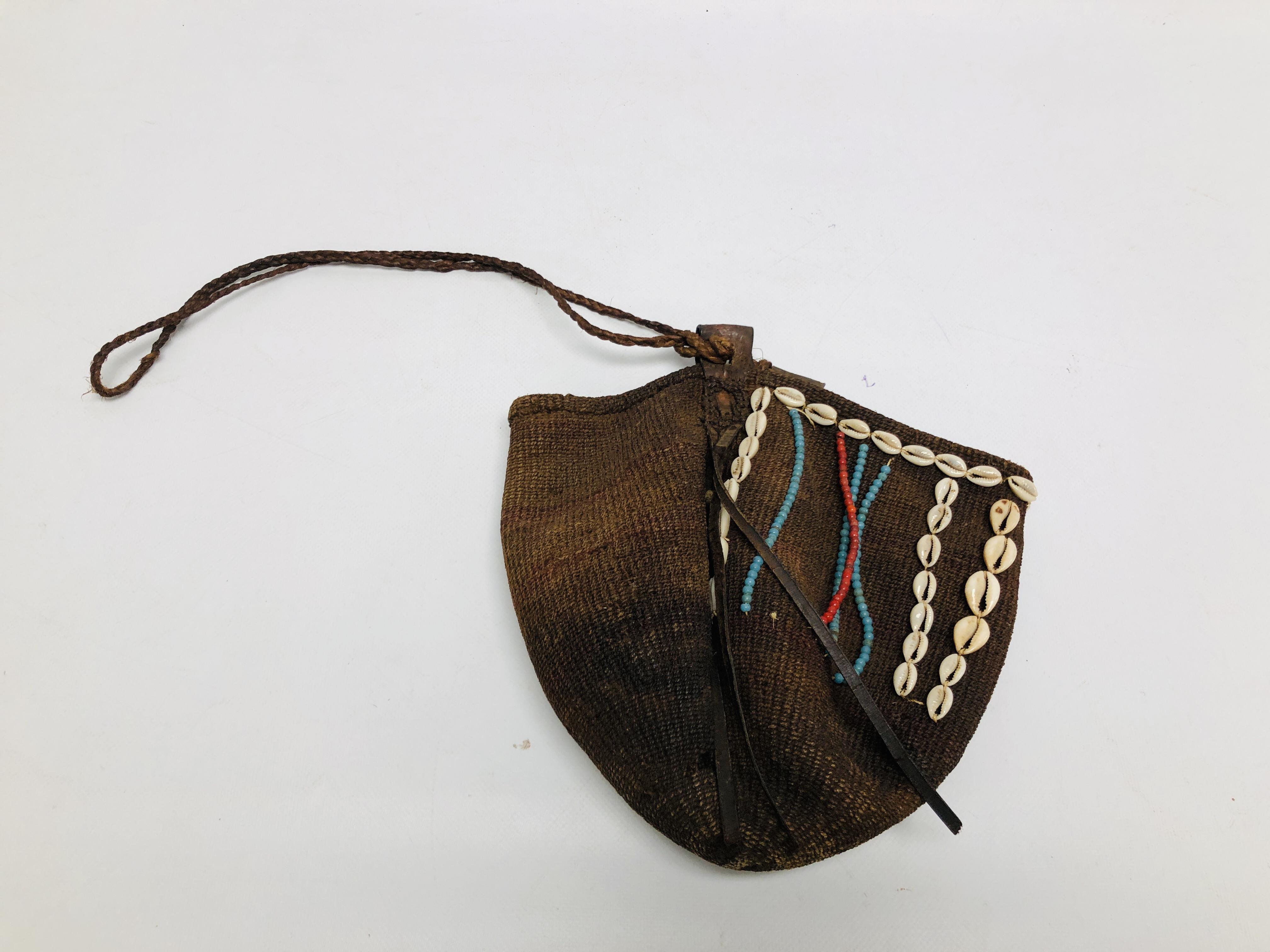 AN AFRICAN KIKUYU BAG APPLIED WITH COWRIE SHELLS AND BEADS