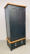 A MODERN LIGHT OAK TRIMMED DOUBLE WARDROBE WITH DRAWER TO BASE W 90CM. D 56CM. H 190CM.