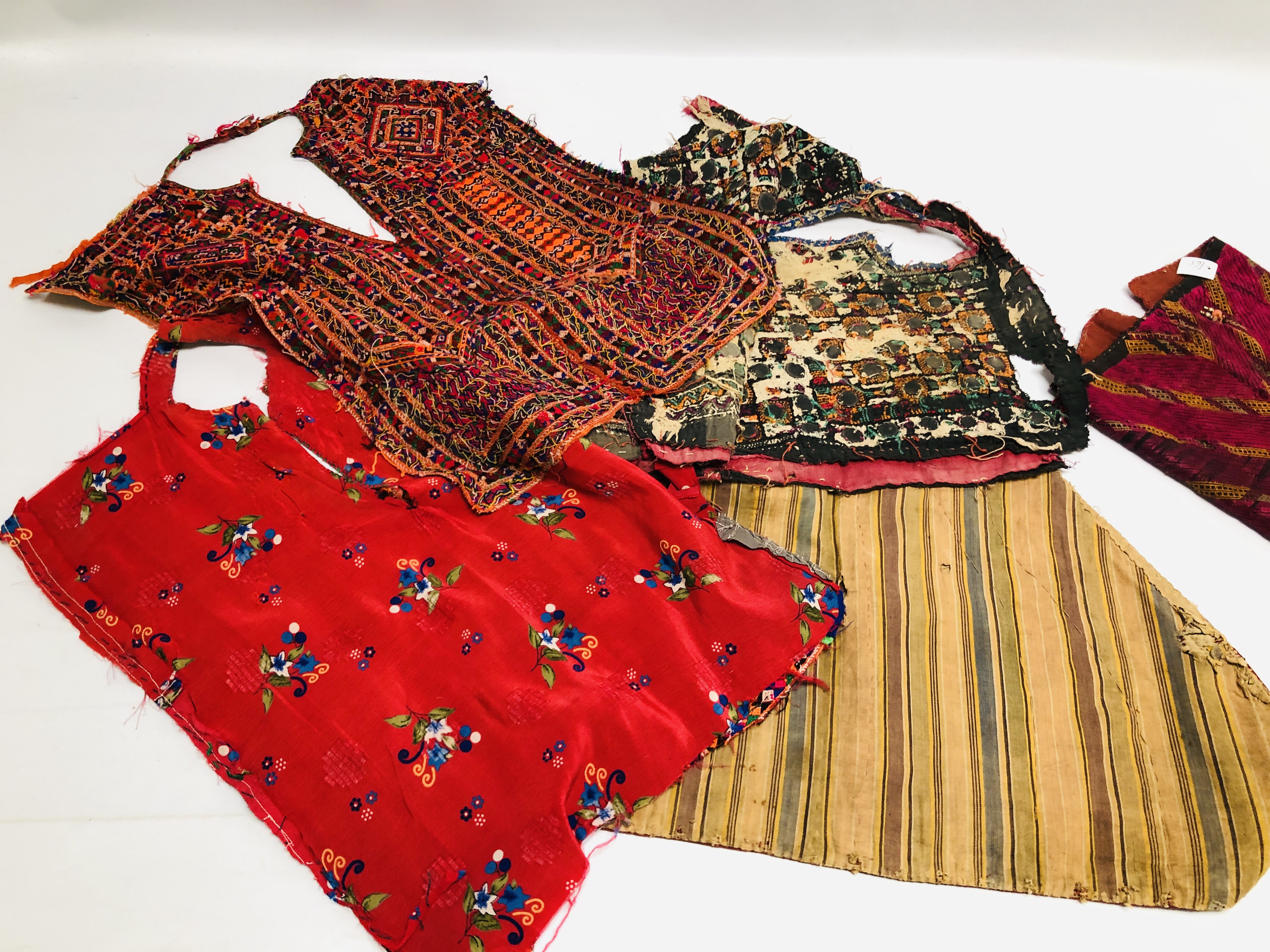 A GROUP OF ETHNIC AND TRIBAL GARMENTS TO INCLUDE DRESS YOLKS TO INCLUDE ELABORATELY HAND MADE - Image 10 of 10